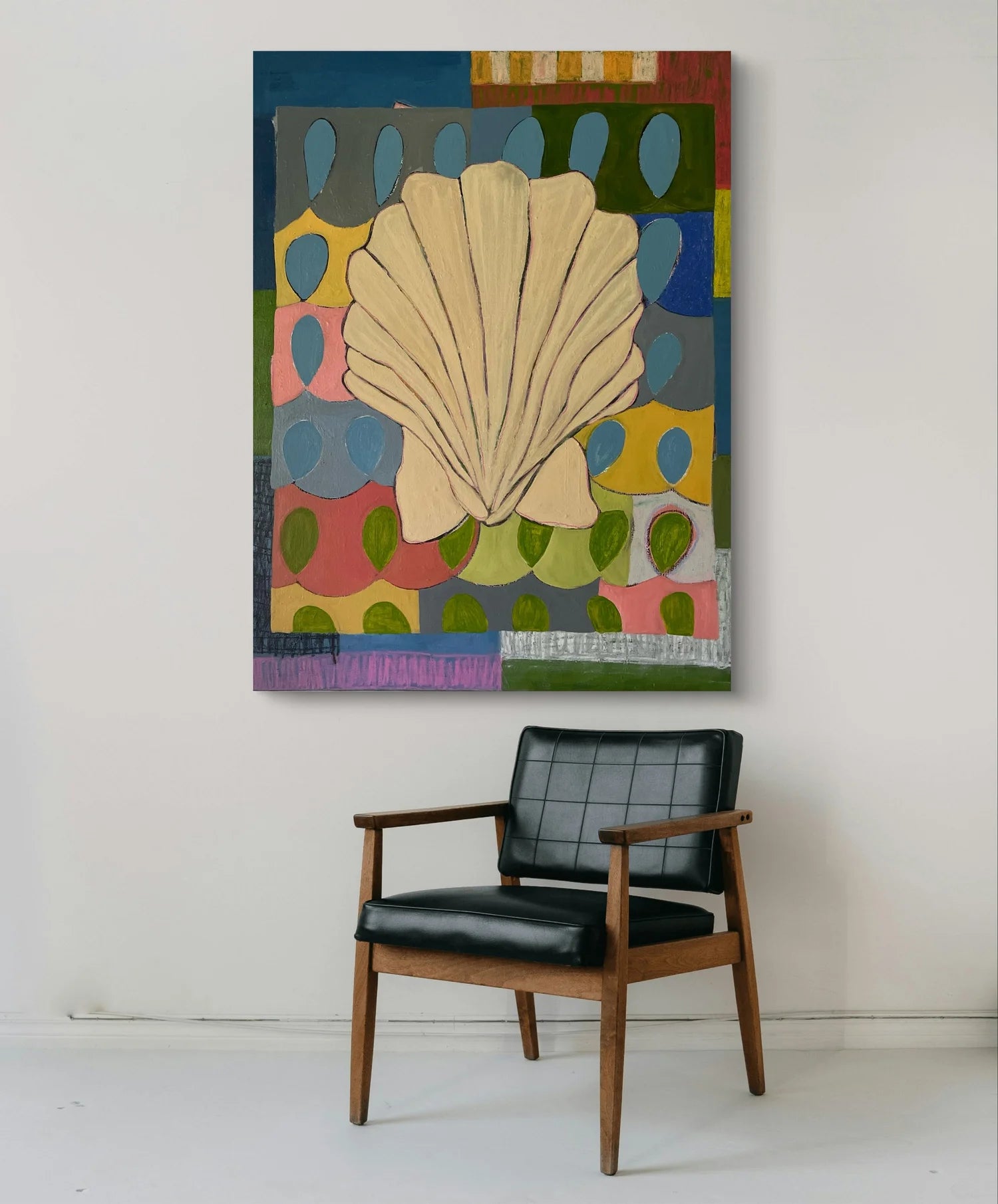 Colorful abstract painting with a shell on a wall above a black chair. "A Seashell Found From A Location Unknown acrylic painting by Marley Alvarez"