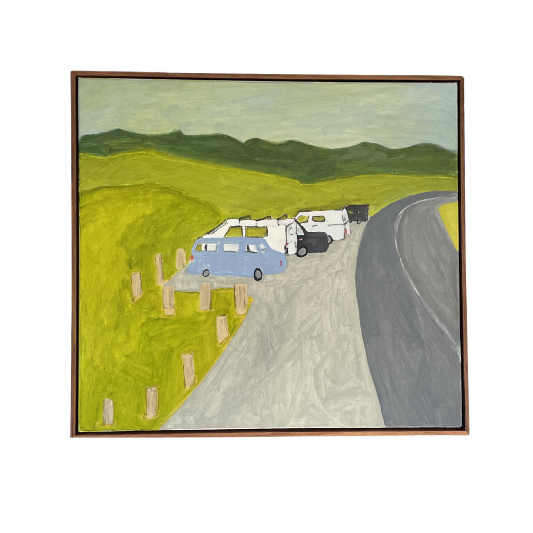 Framed artwork of a road with cars and green fields on a white background