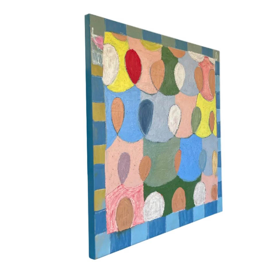 An abstract canvas painting featuring a colorful pattern of overlapping circles and geometric shapes, shown at an angle on a plain white background.