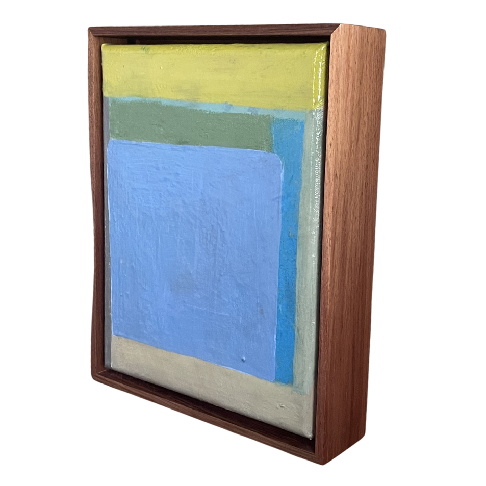 Abstract art piece with a wooden frame on a white background