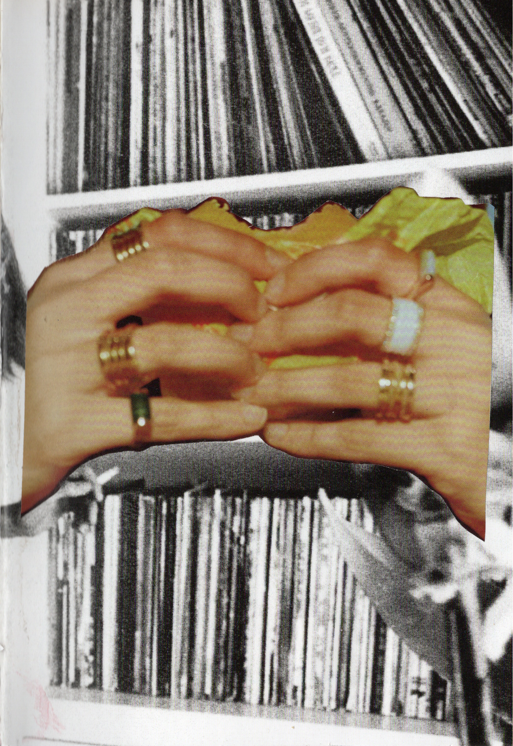 Open book with text 'In a world of' and an image of hands wearing rings.